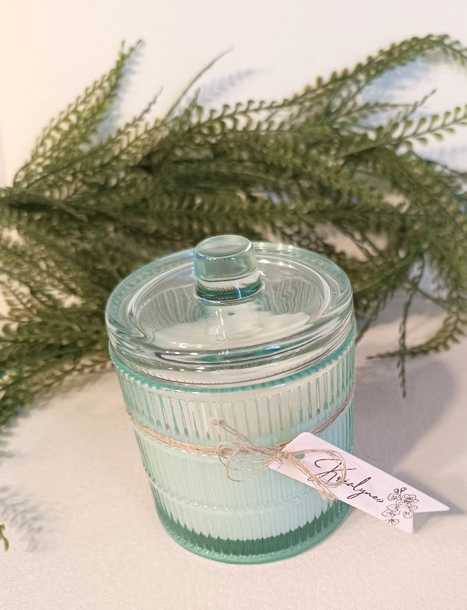 Bougie parfumée "Monoï" contenant en verre turquoise