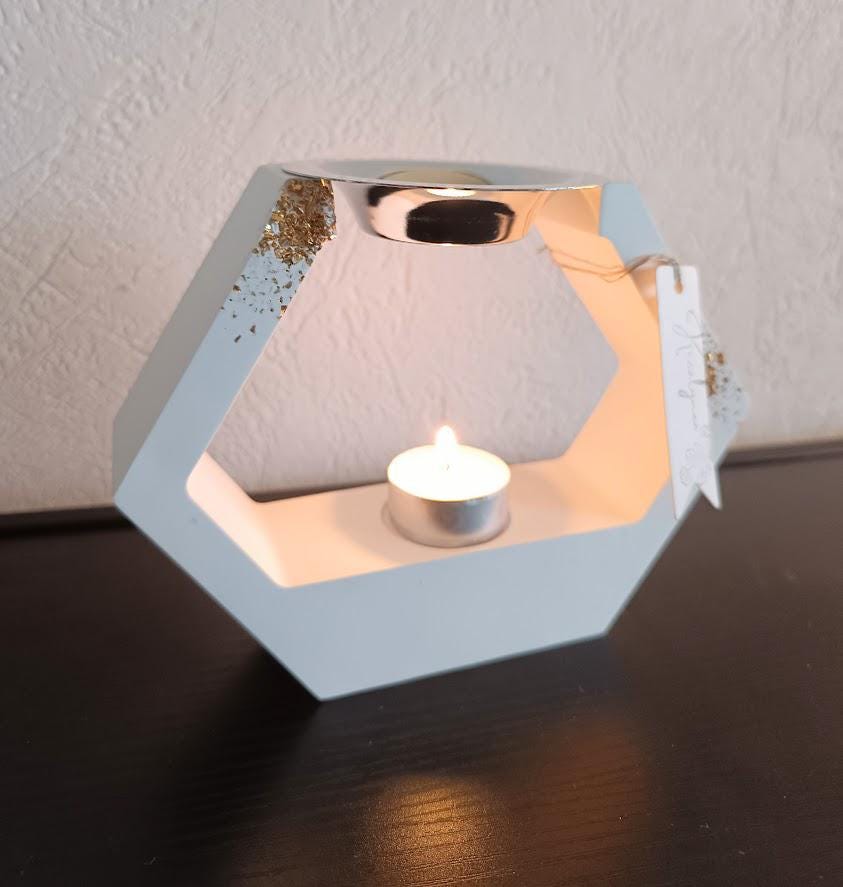 Brûle parfum losange blanc et or.