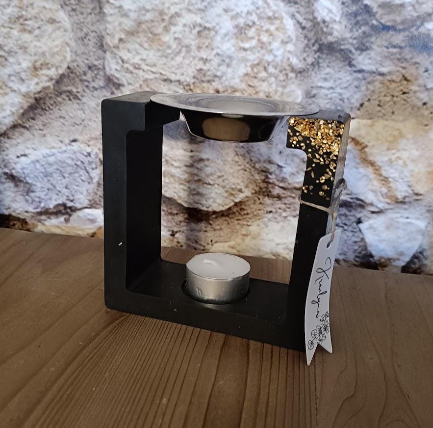 Brûle parfum carré noir et or.